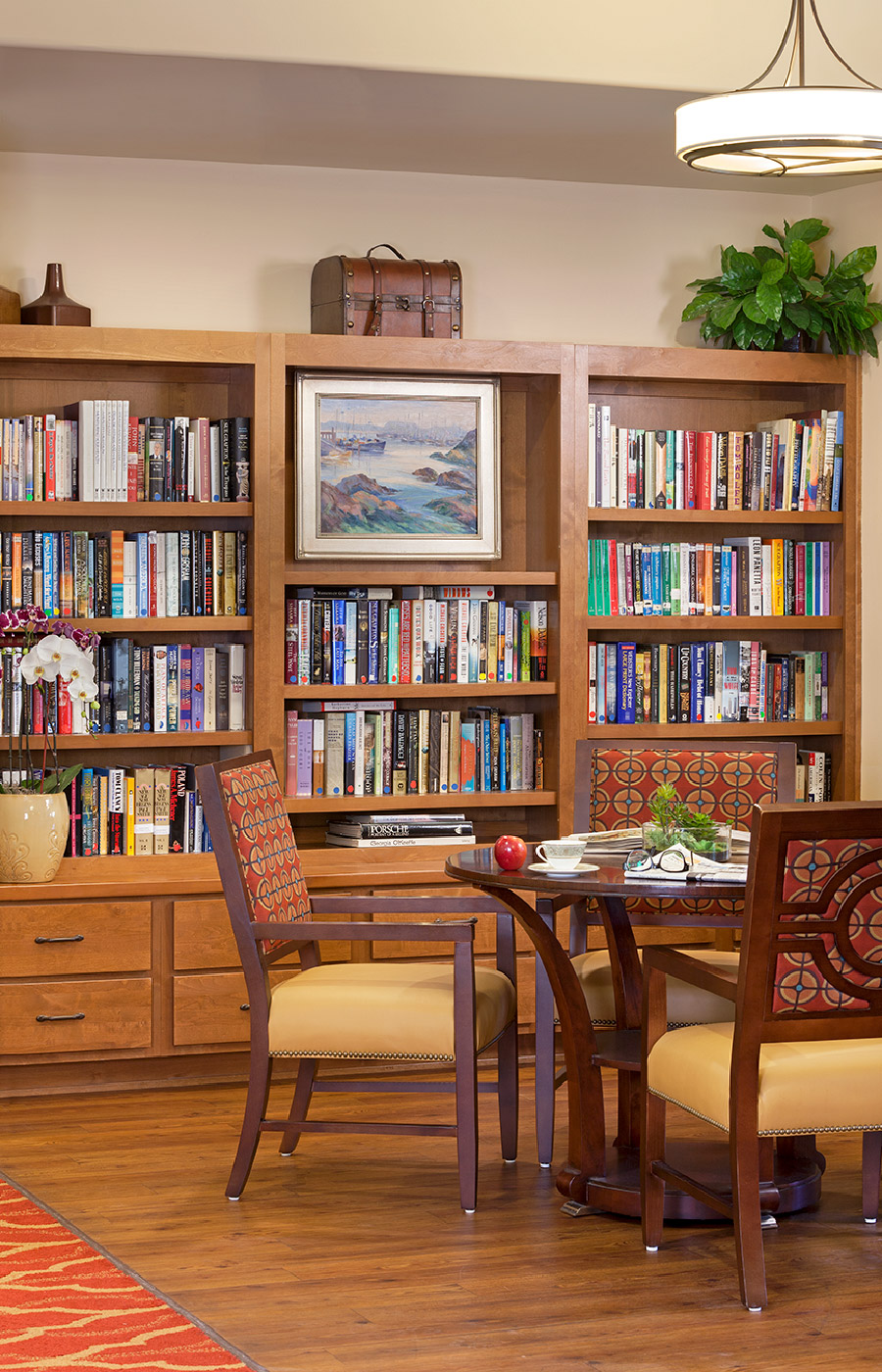 Bookshelf - Gallery A large bookshelf area with a dining table